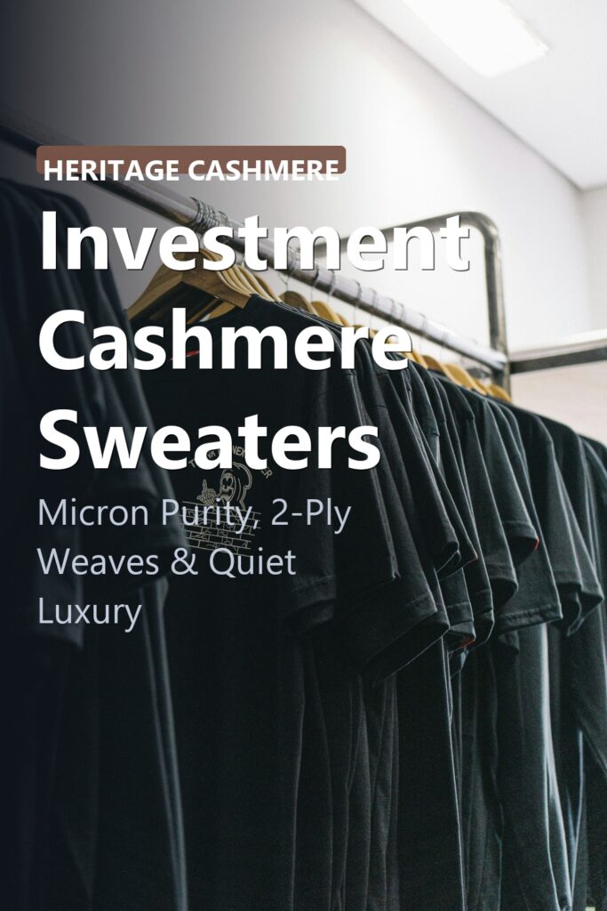 Folded soft neutral cashmere knit sweaters on wooden shelf